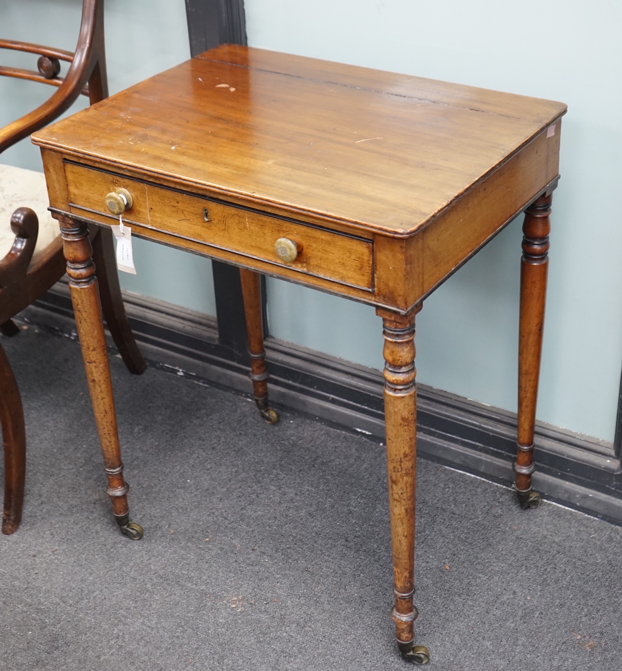 A George IV mahogany writing table with frieze drawer on turned legs, width 61cm, depth 45cm, height 73cm